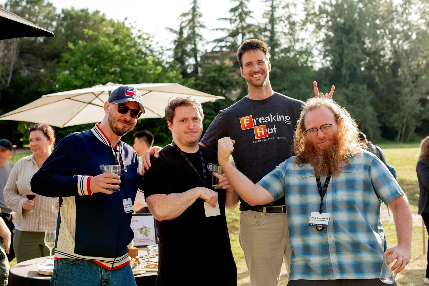 Four Close teammates hamming it up for the camera at the company retreat, one giving another bunny ears